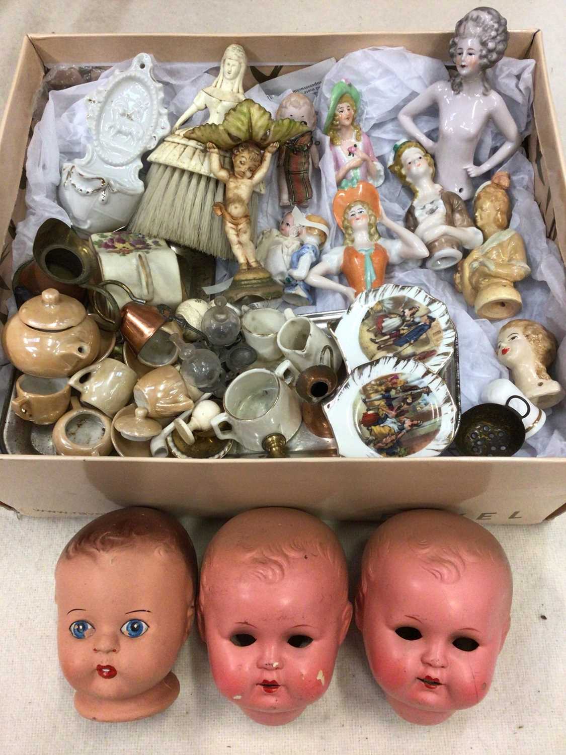 Lot 490 - Three vintage doll's heads, various half dolls, miniature teaware etc