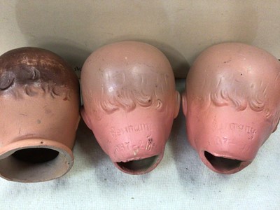 Lot 490 - Three vintage doll's heads, various half dolls, miniature teaware etc