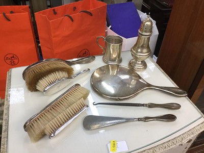 Lot 724 - Silver sugar caster, silver christening mug, silver backed brushes and shoe horn and button hook.