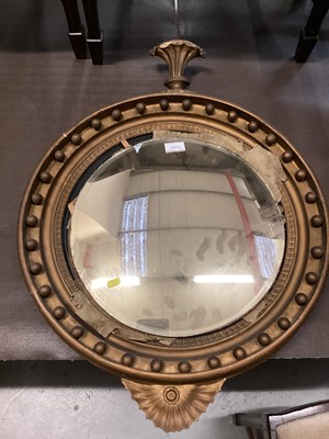 Lot 1014 - Nineteenth century convex wall mirror in circular gilt frame with ball decoration, 77cm high, 55cm wide