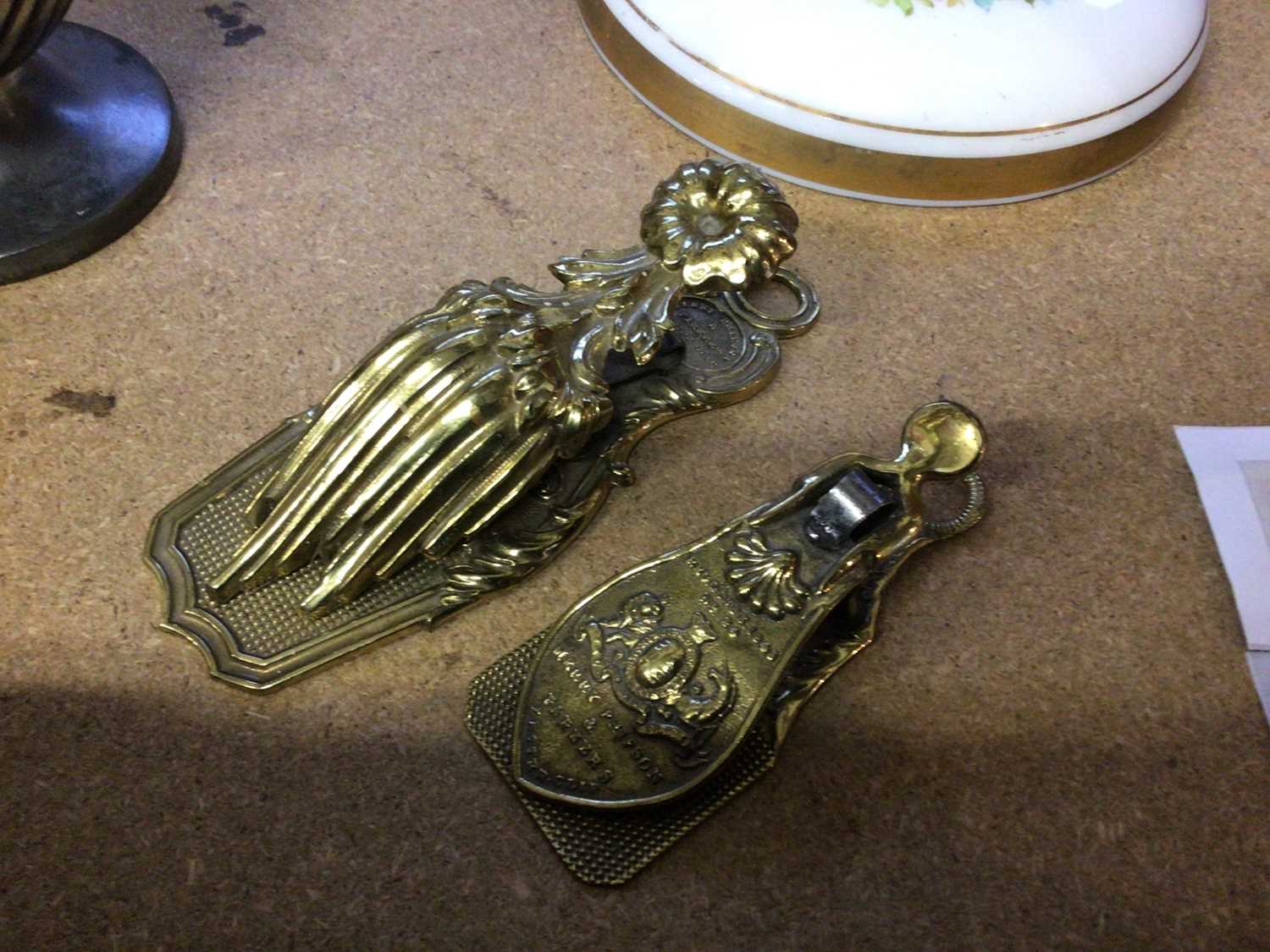 Lot 173 - Two Merry Phipson brass letter clips