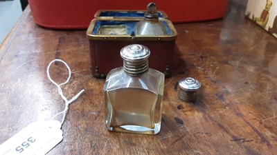 Lot 355 - 19th century red leather case containing a pair of scent bottles with white metal tops.