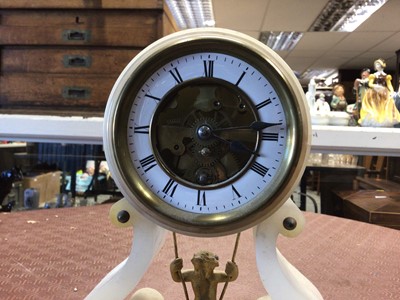 Lot 257 - French alabaster mantel clock with gilt cherub on a swing pendulum
