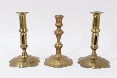 Lot 820 - Pair of brass early 18th century candlesticks with shaped bases, together with single Queen Anne candlestick