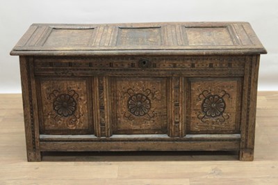 Lot 1306 - 18th century carved oak coffer, with triple panel lid and rosette carved triple panel front on stiles, 103cm wide x 46cm deep x 53cm high