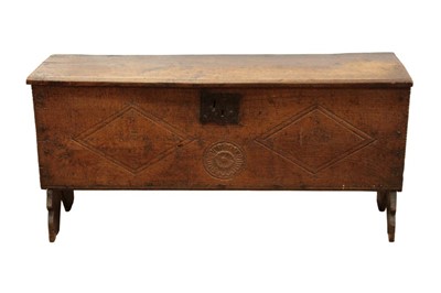 Lot 1307 - 17th century five plank coffer, with expansive hinged top with chip carved ends and lozenge and rosette carved front on V-cut ends, 122cm wide x 38cm deep x 155cm high