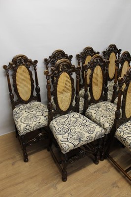 Lot 1411 - Set of eight Jacobean style carved oak high back dining chairs.