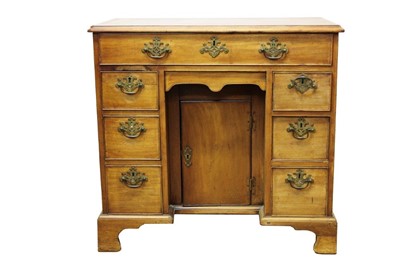 Lot 1323 - George III mahogany kneehole desk, with seven drawers and concealed frieze drawer about the cupboard kneehole on bracket feet 83cm wide x 47cm deep x 79cm high