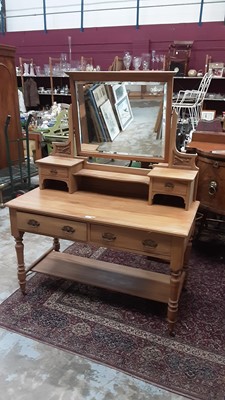 Lot 1033 - Edwardian dressing table with raised bevelled mirror back, two jewellery drawers and a further two drawers below on turned legs with undertier