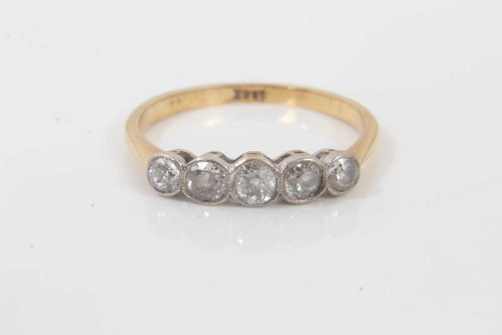 Lot 142 - 18ct gold diamond five stone ring