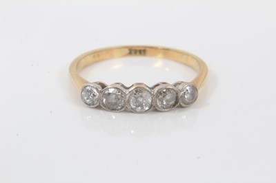 Lot 142 - 18ct gold diamond five stone ring