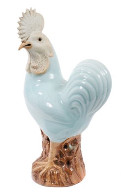 Lot 52 - Large Chinese celadon glazed model of a cockerel, with biscuit glazed face and crest, 19th/20th century, measuring 38.5cm high