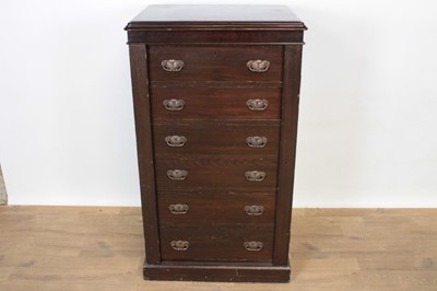 Lot 1351 - Late 19th century mahogany wellington chest, with six drawers between hinged stiles on plinth base, 64cm wide x 51cm deep x 111cm high