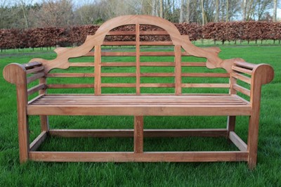 Lot 1353 - Lutchens style teak bench, typical arched form, 172cm long