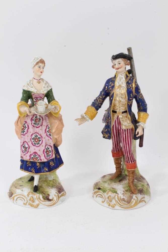 Lot 15 - A pair of German porcelain figures of a shepherd and shepherdess, in Derby style