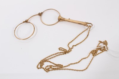 Lot 720 - Antique gilt metal lorgnette on a yellow metal chain