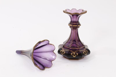 Lot 272 - A Victorian amethyst tinted glass scent bottle and stopper