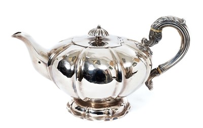 Lot 443 - William IV Irish silver melon shaped teapot with scroll silver handle