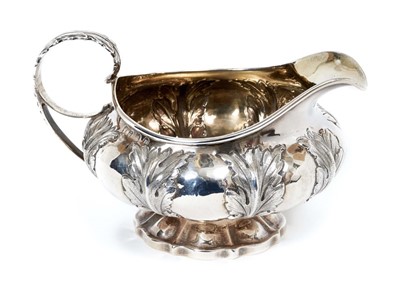 Lot 451 - George IV silver cream jug of compressed melon form with chased acanthus leaf decoration