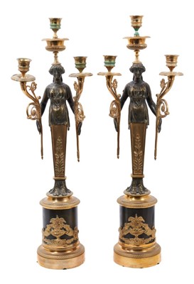 Lot 808 - Pair of Empire style bronze and ormolu three branch candelabra