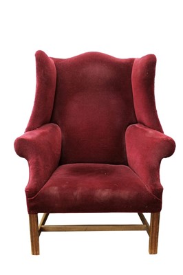 Lot 1381 - George III style wing armchair, upholstered in red velvet, raised on square internally chamfered legs