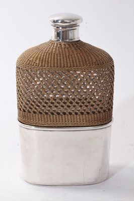Lot 382 - Victorian silver mounted glass hip flask with rattan cover and silver screw fit top, (London 1868)