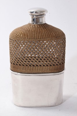 Lot 440 - Victorian silver mounted glass hip flask with rattan cover and silver screw fit top, (London 1868)