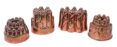 Lot 855 - Four antique copper jelly moulds, including a castelated mould numbered 213, 12.5cm high, an oval mould stamped Univ. Coll. and stamped B, two smaller stamped 261, 112. (4)