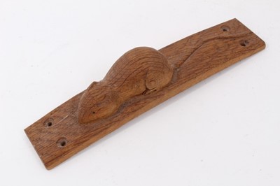 Lot 856 - Carved oak furniture mount, in the manner of Robert Mouseman Thompson, of bowed form, 20cm long