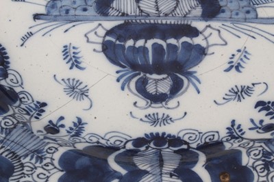 Lot 244 - 18th century Dutch blue and white delftware dish, decorated with the peacock pattern, with yellow-painted rim, marked to base, possibly for De Porceleyne Claeuw, 34.5cm diameter