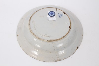 Lot 244 - 18th century Dutch blue and white delftware dish, decorated with the peacock pattern, with yellow-painted rim, marked to base, possibly for De Porceleyne Claeuw, 34.5cm diameter