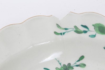Lot 249 - A Worcester Giles-decorated plate, circa 1770, decorated in green with foliage, together with two 19th century Derby dishes, and two transfer ware platters (5)