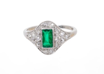 Lot 647 - Art Deco emerald and diamond ring with a central rectangular step cut emerald estimated to weigh approximately 0.40cts surrounded by 16 pavé set old cut diamonds in millegrain setting on platinum s...