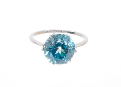 Lot 650 - Art Deco blue zircon single stone ring with round mixed cut blue zircon measuring approximately 10mm-10.25mm diameter in platinum claw setting on 18ct white gold shank. Ring size L.