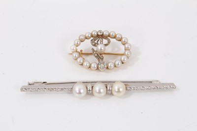 Lot 654 - Edwardian Art Nouveau pearl and diamond wreath brooch  with a stylized diamond and pearl floral motif within a pearl border in platinum and gold setting, 25mm, together with a cultured pearl and wh...