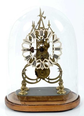 Lot 974 - Victorian skeleton clock with single fusee movement, anchor escapement, striking on a bell (bell now lacking), pierced white chapter ring with Roman numerals, in a pierced brass Gothic Cathedral-st...