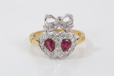 Lot 706 - Victorian style ruby and diamond sweetheart ring with two hearts surmounted by a ribbon with two pear cut rubies surrounded by brilliant cut diamonds, pierced gallery on 18ct gold shank. London 198...