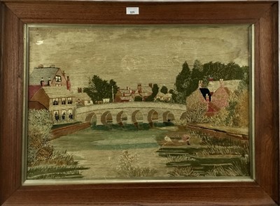 Lot 325 - Early 20th century wool work picture- river scene, in glazed frame