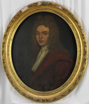 Lot 1204 - 18th century, English School, oval oil on canvas laid on board - portrait of a bewigged Gentleman, 73cm x 60cm, in get frame