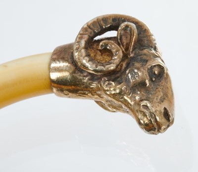 Lot 429 - Antique French Torque bangle with rams head mounts