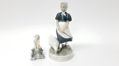 Lot 1115 - Two Royal Copenhagen porcelain models - Fawn riding tortoise number 858 and Lady with goose number 527