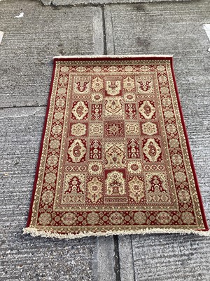 Lot 1127 - Belgian wool rug with geometric decoration on red and gold ground