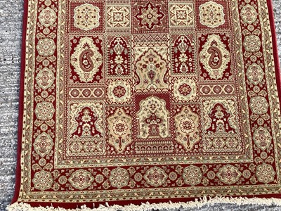 Lot 1127 - Belgian wool rug with geometric decoration on red and gold ground