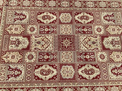 Lot 1127 - Belgian wool rug with geometric decoration on red and gold ground