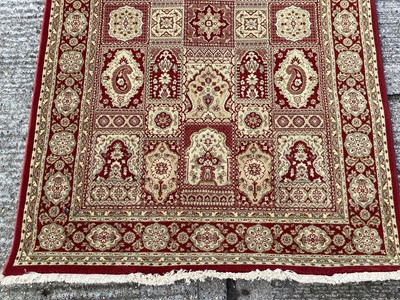 Lot 1127 - Belgian wool rug with geometric decoration on red and gold ground