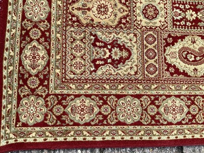 Lot 1127 - Belgian wool rug with geometric decoration on red and gold ground