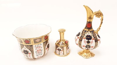 Lot 1155 - Royal Crown Derby imari ewer, 25.5cm high, matching jardinere, 14cm high, and a bell, 13.5cm high, all pattern number 1128 (3)