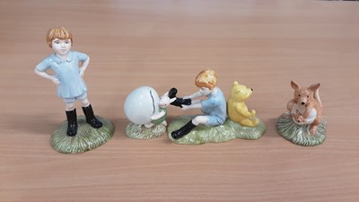 Lot 1175 - Eight Royal Doulton Winnie the Pooh figures