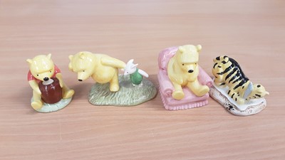 Lot 1175 - Eight Royal Doulton Winnie the Pooh figures