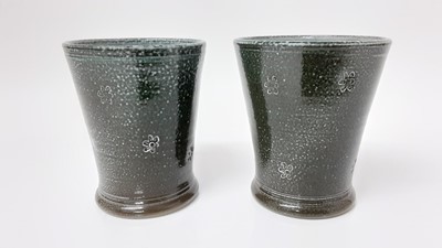 Lot 1185 - Pair of Steve Harrison studio pottery salt glazed beakers, dated 1996, 11cm high